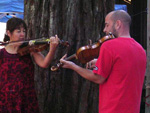 final camp performance of fiddle teacher and beginning student